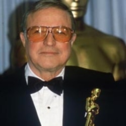 Gene Kelly receives an Oscar at the Academy Awards in 1984 to replace the one he lost when fire destroyed his home in 1983