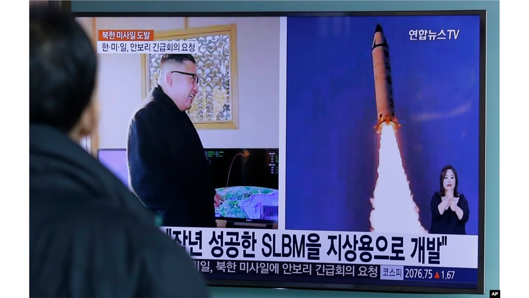 A man watches a TV news program showing photos published in North Korea's Rodong Sinmun newspaper of North Korea's "Pukguksong-2" missile launch and North Korean leader Kim Jong Un, at Seoul Railway Station, in Seoul, South Korea, Feb. 13, 2017. The Trump White House says the missile threat posed by North Korea outweighs any controversy surrounding Philippines President Duterte's domestic policies.