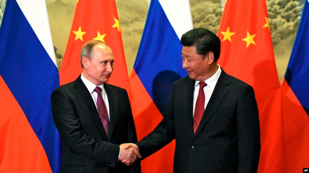 2016年6月25日中国国家主席习近平在北京会晤到访的俄罗斯总统普京。（美联社）(photo:VOA)