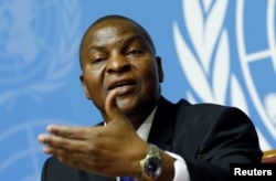 FILE - Faustin-Archange Touadera, president of the Central African Republic, addresses a news conference at the Untied Nations in Geneva, Switzerland, Sept. 27, 2017.