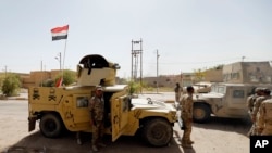 伊拉克保安部队击退伊斯兰国，进入费卢杰市中心。（2016年6月17日）
