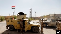 Iraqi security forces enter central Fallujah after fight against the Islamic State militants, Iraq, June 17, 2016.