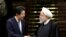  Japanese Prime Minister Shinzo Abe, left, and Iranian President Hassan Rouhani shake hands after their joint press conference at the Saadabad Palace in Tehran, Iran, June 12, 2019. 