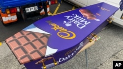 This photo provided by Ross Hall shows a casket designed to look like a chocolate bar in Auckland, New Zealand, on April 30, 2020. (Ross Hall via AP)