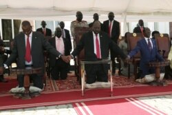 FILE - South Sudan's President Salva Kiir takes part in a national day of prayers for peace at the state house in Juba, South Sudan, Sept. 19, 2019.