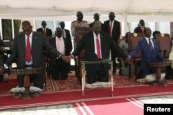 FILE - South Sudan's President Salva Kiir takes part in a national day of prayers for peace at the state house in Juba, South Sudan, Sept. 19, 2019.