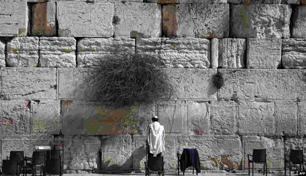 A Jewish man prays at the Western Wall, the most holy site where Jews can pray, in Jerusalem&#39;s Old City.