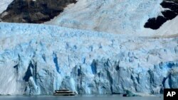 FILE - A tour boat passes near the snout of Spegazzini Glacier in Los Glaciares National Park in Argentina, Feb. 23, 2011.