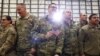 U.S. soldiers wait for a speech by U.S. President Donald Trump as he meets U.S. troops based in Osan Air Base, South Korea, June 30, 2019.