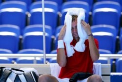 Daniil Medvedev, of the Russian Olympic Committee, cools off during a changeover in a tennis match against Alexander Bublik, of Kazakhstan, during the 2020 Summer Olympics, July 24, 2021, in Tokyo.