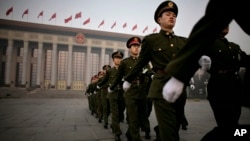 Chinese police officers before a session of the National People's Congress on Monday, March 10, 2008. (AP Photo/Oded Balilty)