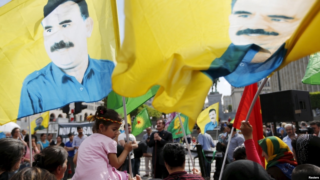 Protesters wave flags with the picture of Kurdistan Workers Party (PKK)'s jailed leader Abdullah Ocalan during a demonstration against the Turkish army operations on Kurdish militants, in central Brussels, Belgium, Aug. 8, 2015. 