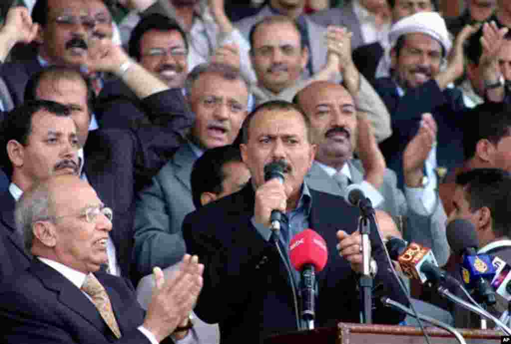Yemeni President Ali Abdullah Saleh, center, talks to his supporters outside the stadium where Saleh's General Congress Party held a convention to nominate its candidate for the polls, in the capital Sana'a, Yemen, Saturday, June 24, 2006. Saleh who has r