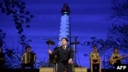 A paraplegic man performs during an event to mark the International Day of Persons with Disabilities, in Pyongyang, Dec. 3, 2019.