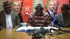FILE: Tendai Biti (center) of the Movement for Democratic Change (MDC) Alliance, speak to reporters in Harare, July 12, 2018. 