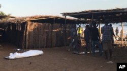 A body lays on the beach were gunmen attacked people in Grand Bassam, Ivory Coast, March 13, 2016. 