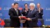 Chinese Minister of Energy Zhang Jianhua and European Commissioner for Climate Action and Energy Miguel Arias Canete during the signing ceremony at a EU-China Summit in Brussels, Belgium, April 9, 2019. 