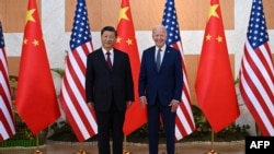 FILE - US President Joe Biden, right, and China's President Xi Jinping meet on the sidelines of the G20 Summit in Nusa Dua on the Indonesian resort island of Bali on Nov. 14, 2022.