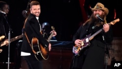 Justin Timberlake, left, and Chris Stapleton perform at the 49th annual CMA Awards at the Bridgestone Arena on Nov. 4, 2015, in Nashville, Tenn. 