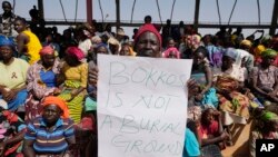 FILE -Victims of an attack protest at an internal displaced camp in Bokkos, Nigeria, December 27, 2023. In late December, at least 140 people were killed by gunmen in remote villages in north-central Plateau state in mass killings blamed on fighting between farmers and herders.