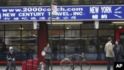 Passengers at a bus station in the Chinatown neighborhood of New York, March 14, 2012.