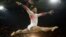 United States' Simone Biles performs on the balance beam during the gymnastics exhibition gala at the 2016 Summer Olympics in Rio de Janeiro, Brazil, Aug. 17, 2016.