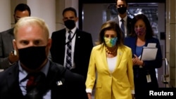 U.S. House Speaker Nancy Pelosi, D-Calif., departs after a closed-door House Democratic caucus meeting amid negotiations over budget and infrastructure legislation at the U.S. Capitol in Washington, Aug. 24, 2021.