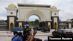 Malaysian Prime Minister Muhyiddin Yassin arrives at the National Palace in Kuala Lumpur, Aug. 16, 2021.