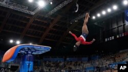 Simone Biles, of the United States, performs on the vault during the gymnastics women's final at the 2020 Summer Olympics, July 27, 2021, in Tokyo.