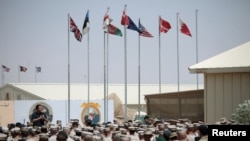 Britain's Prime Minister David Cameron gives a July 4 address to British and U.S. troops at the Camp Leatherneck military base in Helmand Province, Afghanistan on July 4, 2011. 