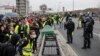 Year's 1st Yellow Vest Event Brings Tear Gas, Fires in France