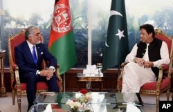 Abdullah Abdullah, chairman of Afghanistan's High Council for National Reconciliation, left, meets with Pakistan Prime Minister Imran Khan, in Islamabad, Sept. 29, 2020. (Credit: Press Information Department)