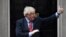 Britain's Prime Minister Boris Johnson joins in the applause on the doorstep of 10 Downing Street in London during the weekly "Clap for our Carers" Thursday, May 7, 2020. The COVID-19 coronavirus pandemic has prompted a public display of appreciation for…