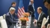 U.S. Secretary of State John Kerry (L) and United Nations Secretary General Ban Ki-moon (R) meet on the sidelines of the COP 21 United Nations conference on climate change in Le Bourget, on the outskirts of Paris, France, Dec. 11, 2015. 