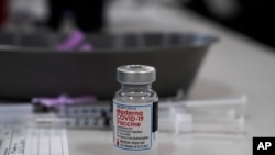 A vial of Moderna COVID-19 vaccine is seen at an ambulance company in Santa Fe Springs, Calif., an. 9, 2021. 