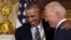 FILE - President Barack Obama laughs with Vice President Joe Biden during a ceremony in the State Dining Room of the White House in Washington, Jan. 12, 2017. 