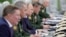 RUSSIA -- Russian President Vladimir Putin (Third Left) visits the National Defence Control Centre (NDCC) to oversee the test of a new Russian hypersonic missile system called Avangard, which can carry nuclear and conventional warheads, in Moscow, Russia 