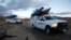 Search and rescue sheriff's vehicles arrive at the crash site of Virgin Galactic's SpaceShipTwo near Cantil, California Nov. 1, 2014.