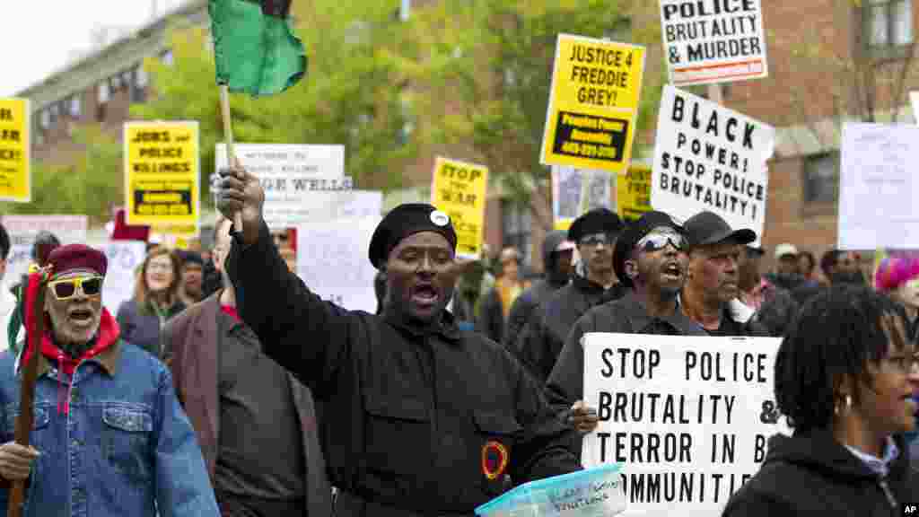 Demonstrators protest in the streets as they march for Freddie Gray to Baltimore's City Hall, in Baltimore, April 25, 2015. 