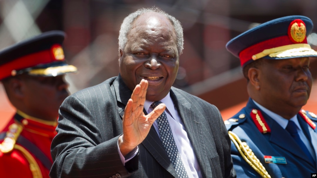 Former Kenyan President Mwai Kibaki arrives for the inauguration of his successor Uhuru Kenyatta, at Kasarani, near Nairobi, Kenya, April 9, 2013. Kibaki has died at the age of 90, President Uhuru Kenyatta announced Friday.