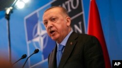 FILE - Turkish President Recep Tayyip Erdogan speaks during a media conference after a summit at NATO headquarters in Brussels, March 24, 2022. Turkey has condemned Russia’s aggression in Ukraine since the start of the invasion in February.