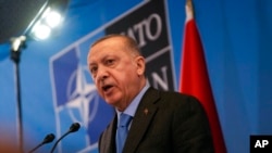 FILE - Turkish President Recep Tayyip Erdogan speaks during a media conference after a summit at NATO headquarters in Brussels, March 24, 2022. Turkey has condemned Russia’s aggression in Ukraine since the start of the invasion in February.