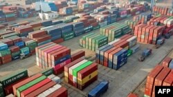 This photo taken on Dec. 7, 2021 shows containers stacked at a port in Lianyungang in China's eastern Jiangsu province.