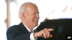 President Joe Biden speaks as he tours a construction area at Portland International Airport, April 21, 2022, in Portland, Ore. 