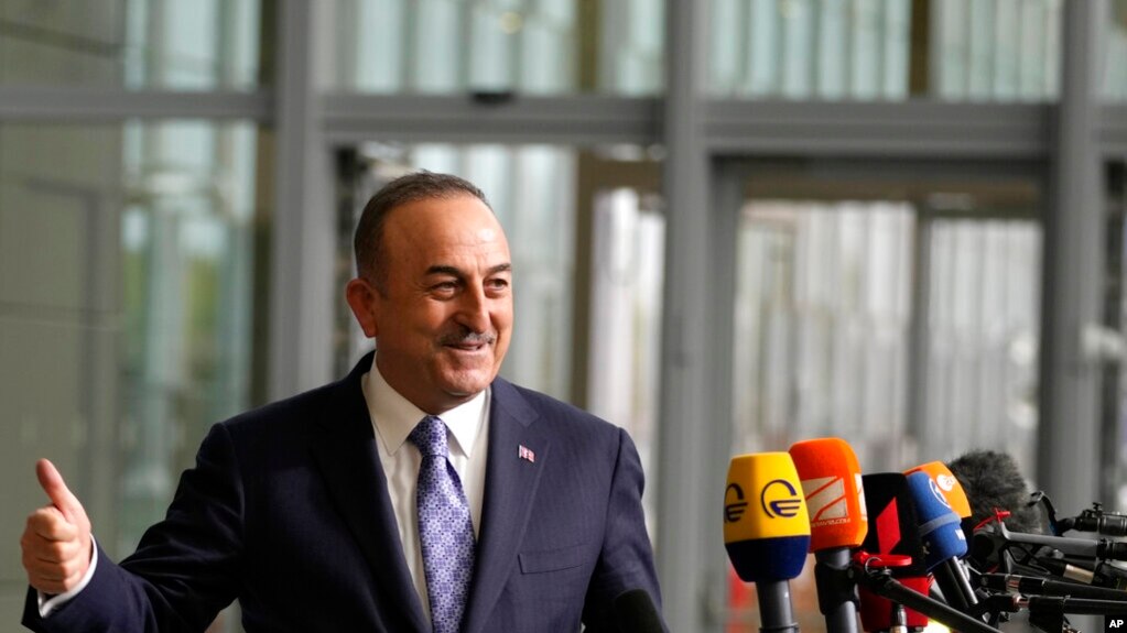 Turkish Foreign Minister Mevlut Cavusoglu speaks with the media as he arrives for a meeting of NATO foreign ministers at NATO headquarters in Brussels, April 6, 2022.