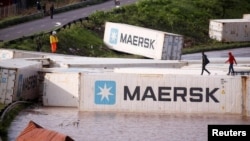 FILE: A view of shipping containers, which were washed away after heavy rains caused flooding, in Durban, South Africa, Apr. 12, 2022.