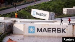 FILE: A view of shipping containers, which were washed away after heavy rains caused flooding, in Durban, South Africa, Apr. 12, 2022.