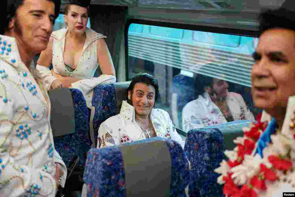 Elvis Presley impersonator Ross Mancini chats with fellow enthusiasts while boarding a train at Sydney Central Railway Station before departing for the Parkes Elvis Festival, as the event returns following the COVID-19 pandemic, in Sydney, Australia.