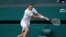 FILE - Russia's Daniil Medvedev in action during his third round match against Croatia's Marin Cilic, Wimbledon, July 3, 2021.