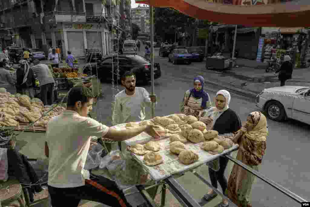 Abu Fahd, a baker who raised the price of his unsubsidized bread last month, says, “People in this [working- and middle-class] neighborhood can afford the increase, but other neighborhoods will struggle if you add any extra costs.” In Cairo, April 6, 2022